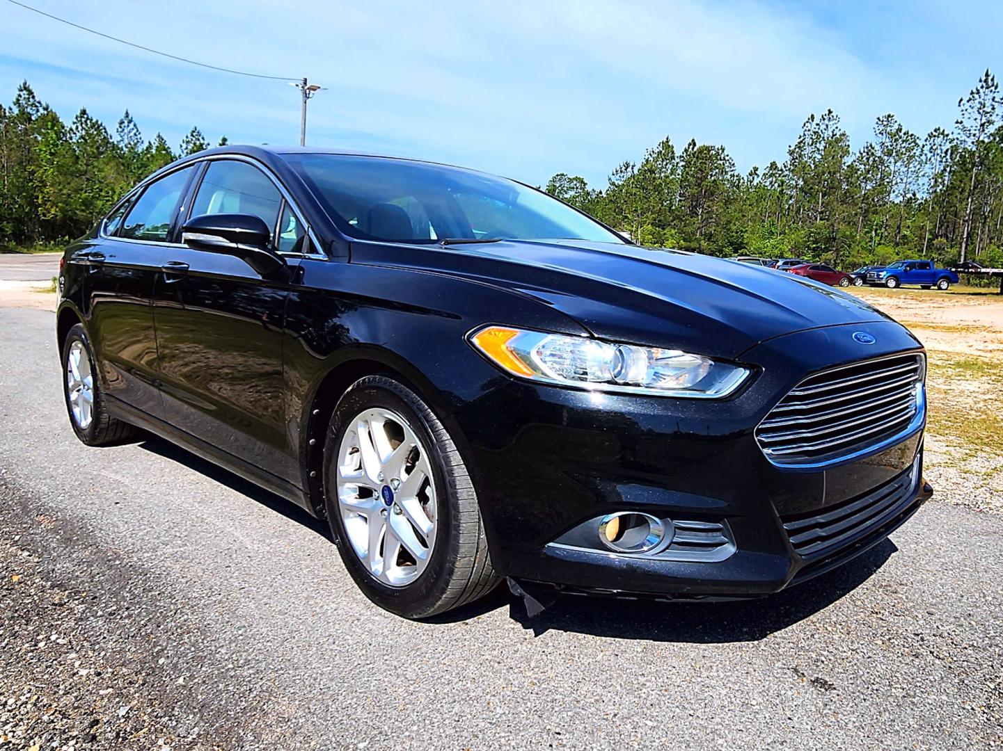 2013 Black Ford Fusion SE (3FA6P0HR3DR) with an 1.6L L4 DOHC 16V engine, Automatic transmission, located at 18001 Kellogg Rd, Saucier, MS, 39574, (228) 832-1441, 139.421463, -76.641457 - Photo#1