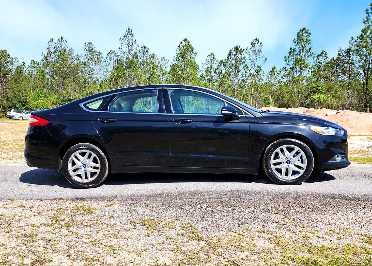 2013 Black Ford Fusion SE (3FA6P0HR3DR) with an 1.6L L4 DOHC 16V engine, Automatic transmission, located at 18001 Kellogg Rd, Saucier, MS, 39574, (228) 832-1441, 139.421463, -76.641457 - Photo#2