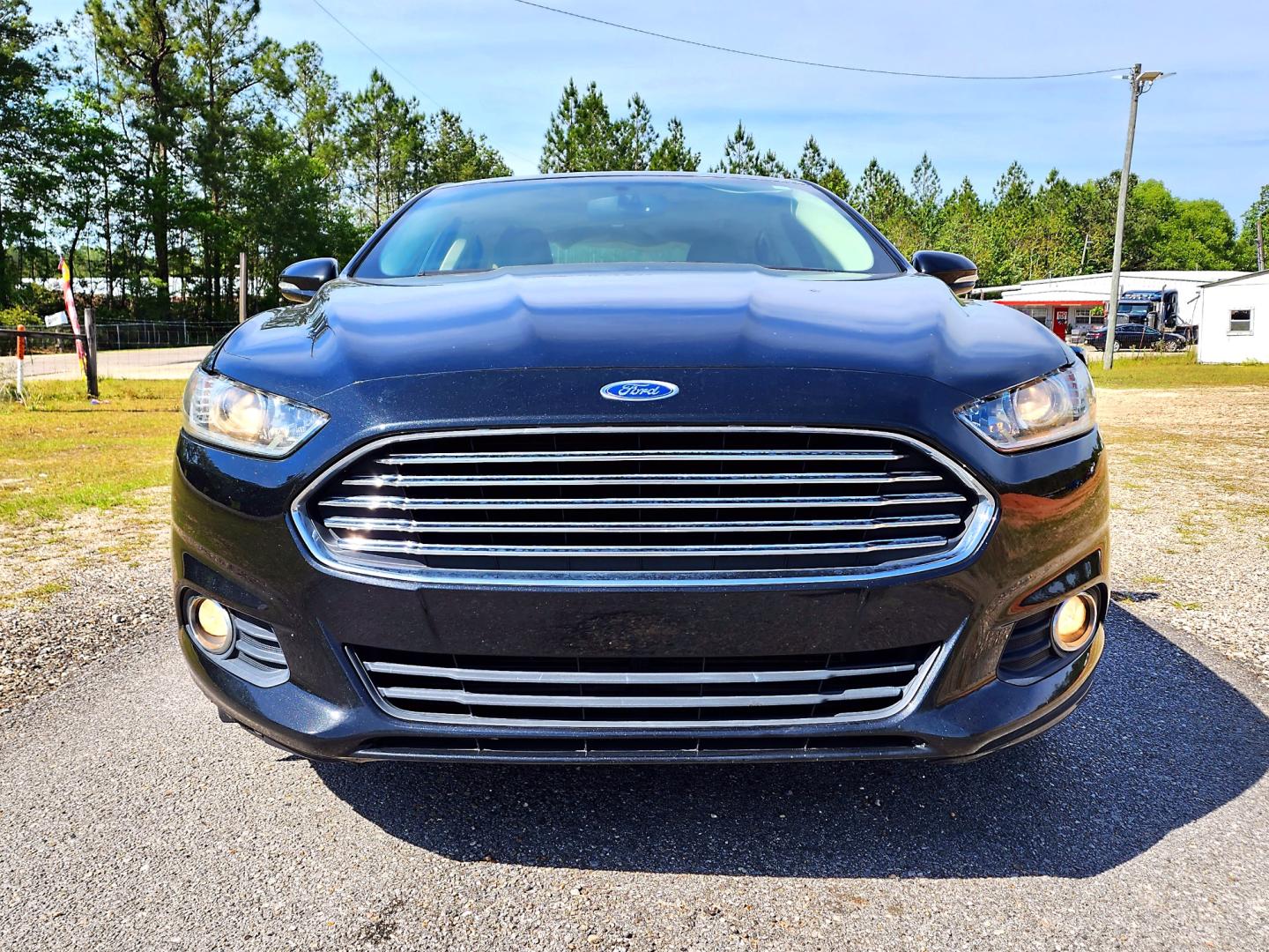 2013 Black Ford Fusion SE (3FA6P0HR3DR) with an 1.6L L4 DOHC 16V engine, Automatic transmission, located at 18001 Kellogg Rd, Saucier, MS, 39574, (228) 832-1441, 139.421463, -76.641457 - Photo#3