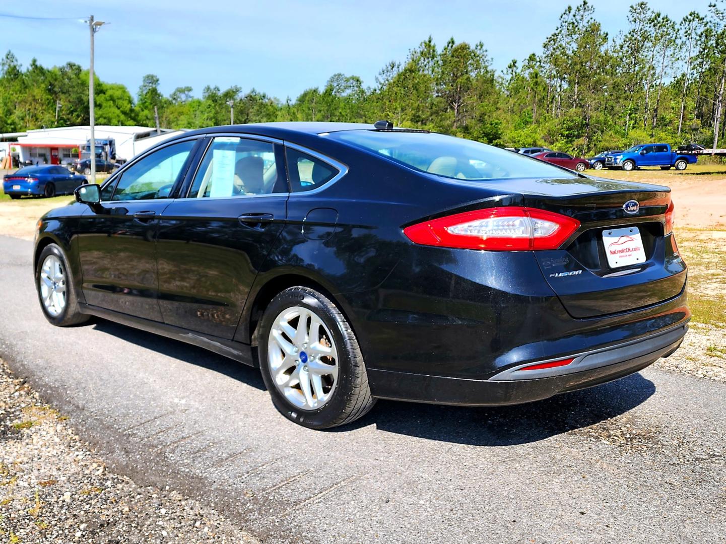 2013 Black Ford Fusion SE (3FA6P0HR3DR) with an 1.6L L4 DOHC 16V engine, Automatic transmission, located at 18001 Kellogg Rd, Saucier, MS, 39574, (228) 832-1441, 139.421463, -76.641457 - Photo#6