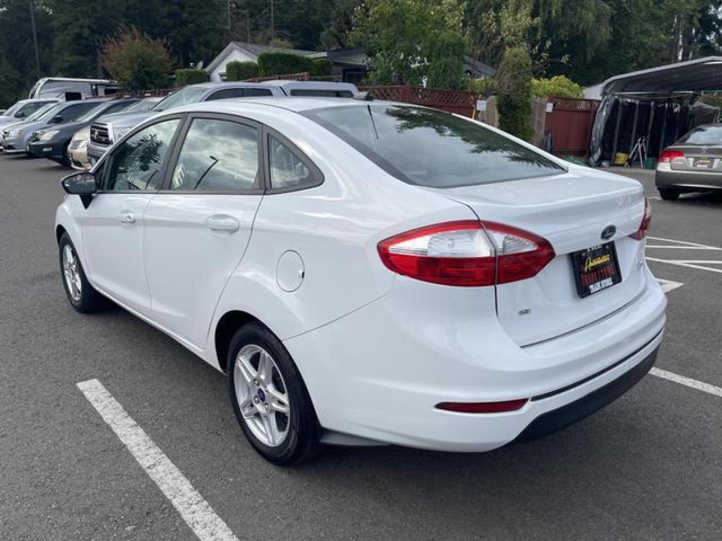 2017 White /Black Ford Fiesta SE Sedan 4D (3FADP4BJ9HM) , Auto, 6-Spd SelectShift transmission, located at 18001 Kellogg Rd, Saucier, MS, 39574, (228) 832-1441, 39.421459, -76.641457 - Photo#1