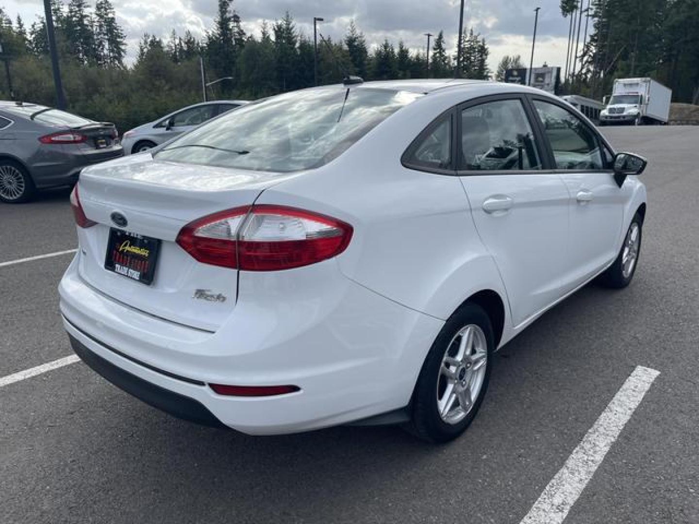 2017 White /Black Ford Fiesta SE Sedan 4D (3FADP4BJ9HM) , Auto, 6-Spd SelectShift transmission, located at 18001 Kellogg Rd, Saucier, MS, 39574, (228) 832-1441, 39.421459, -76.641457 - Photo#2