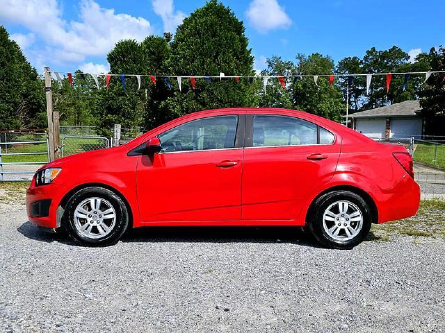 2012 Red /Grey Chevrolet Sonic LT Sedan 4D (1G1JC5SH7C4) , Automatic, 6-Spd transmission, located at 18001 Kellogg Rd, Saucier, MS, 39574, (228) 832-1441, 139.421463, -76.641457 - Photo#4