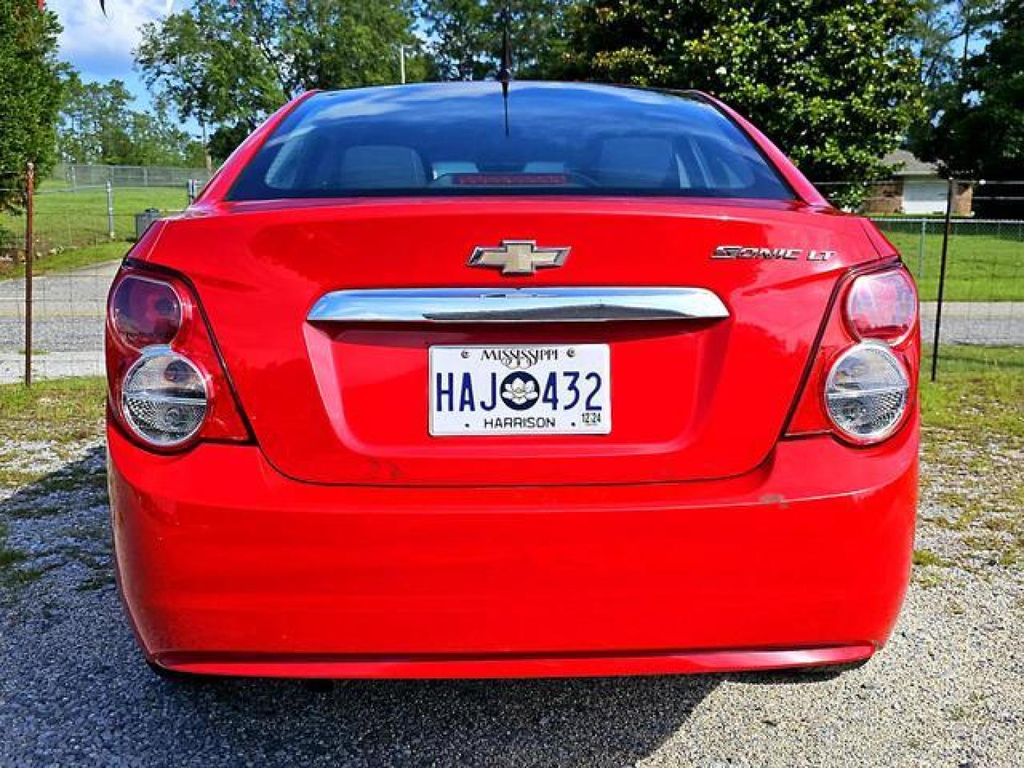 2012 Red /Grey Chevrolet Sonic LT Sedan 4D (1G1JC5SH7C4) , Automatic, 6-Spd transmission, located at 18001 Kellogg Rd, Saucier, MS, 39574, (228) 832-1441, 139.421463, -76.641457 - Photo#7