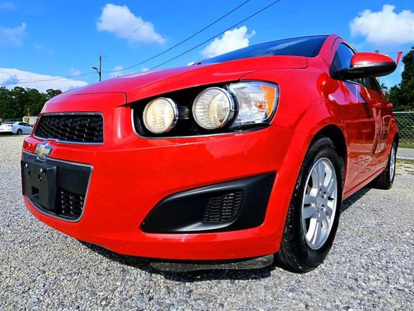 2012 Red /Grey Chevrolet Sonic LT Sedan 4D (1G1JC5SH7C4) , Automatic, 6-Spd transmission, located at 18001 Kellogg Rd, Saucier, MS, 39574, (228) 832-1441, 139.421463, -76.641457 - Photo#18