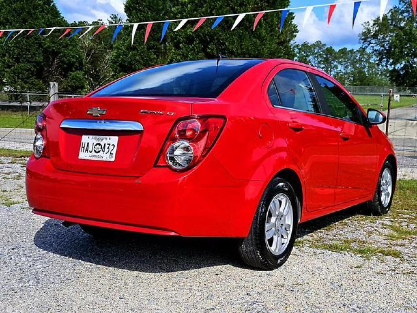 2012 Red /Grey Chevrolet Sonic LT Sedan 4D (1G1JC5SH7C4) , Automatic, 6-Spd transmission, located at 18001 Kellogg Rd, Saucier, MS, 39574, (228) 832-1441, 139.421463, -76.641457 - Photo#5