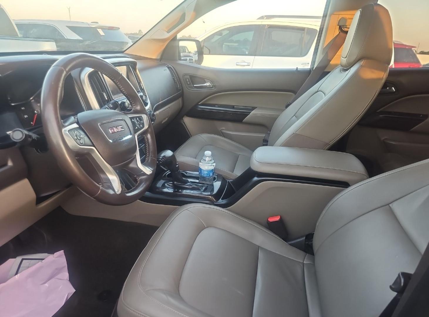 2015 BRONZE GOLD /BEIGE LEATHER GMC Canyon SLT Crew Cab 2WD Short Box (1GTG5CE37F1) with an 3.6L V6 DOHC 24V engine, 6-Speed Automatic transmission, located at 18001 Kellogg Rd, Saucier, MS, 39574, (228) 832-1441, 139.421463, -76.641457 - 2015 GMC Canyon SLE 4DOOR 2WD FUEL SAVER, EXTREMELY WELL MAINTAINED, HIGHWAY MILES, CARFAX CHECKED OUT, DEALER SERVICED, OUR SERVICE TECH HAS INSPECTED THIS CAR AND CHECKED IT OUT. GREAT EZ FAST FINANCING, BOOK VALUE $25,700. BUY IT NOW $20,989.00.. AND OUR LEANDING BANK FINANCING GETS YOU ROLLI - Photo#1