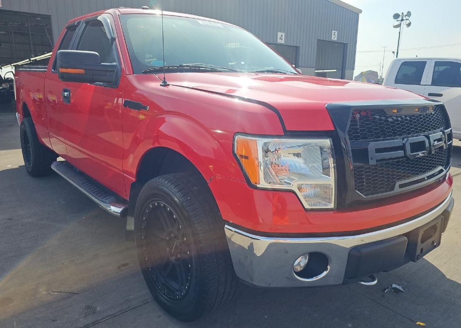 2011 Red Ford F-150 FX4 SuperCab 6.5-ft. Bed 4WD (1FTFX1EF4BF) with an 5.0L V8 engine, 4-Speed Automatic transmission, located at 18001 Kellogg Rd, Saucier, MS, 39574, (228) 832-1441, 139.421463, -76.641457 - 2011 Ford F-150 XLT, 4X4WD, V8,WE HAVE THE BEST AUTO FINANCING IN AMERICA HERE BLACK CUSTOM GRILL, BLACK CUSTOM MAG WHEELS, CHROME PACKAGE, Towing Package, Spare Tire, Keyless Entry, Fog Lights, Trailer Hitch, Trailer Wiring, Super Cab, Bed Liner, and Front Bench Seat, Bluetooth Connection, Chrom - Photo#1