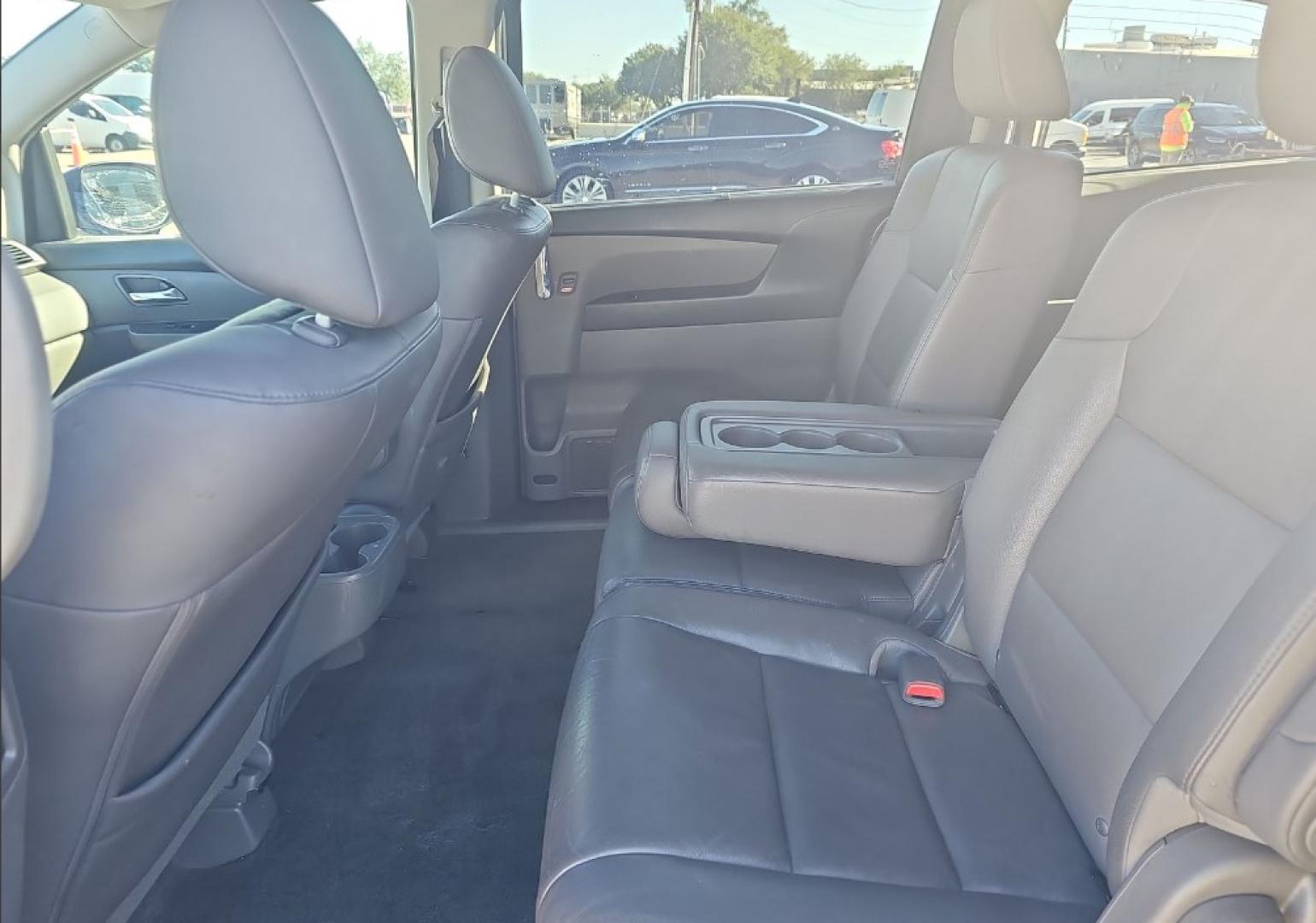 2016 Gray Honda Odyssey EX-L (5FNRL5H65GB) with an 3.5L V6 SOHC 24V engine, 6A transmission, located at 18001 Kellogg Rd, Saucier, MS, 39574, (228) 832-1441, 139.421463, -76.641457 - 2016 Honda Odyssey SE Front-Wheel Drive, Keyless Entry, Passenger Van, Alloy Wheels, Satellite Radio, Side Airbags, Power Sliding Doors, Hondalink, and Keyless Ignition, ALL HWY MILES SUPER CLEAN EXTREMELY WELL MAINTAINED, HIGHWAY MILES, DEALER SERVICED, OUR SERVICE TECH HAS INSPECTED THIS CAR - Photo#3