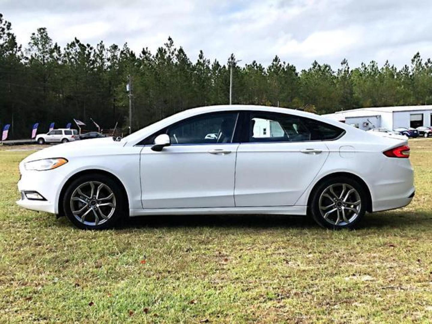 2017 White /Black Ford Fusion S Sedan 4D (3FA6P0G74HR) with an 2.5L L4 DOHC 16V engine, Auto, 6-Spd SelectShift transmission, located at 18001 Kellogg Rd, Saucier, MS, 39574, (228) 832-1441, 139.421463, -76.641457 - Photo#2